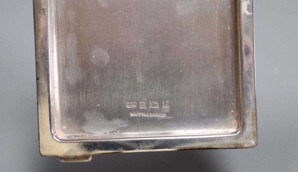 A silver-mounted conical glass scent bottle, sundry other silver-mounted toilet items and an engine-turned silver compact.